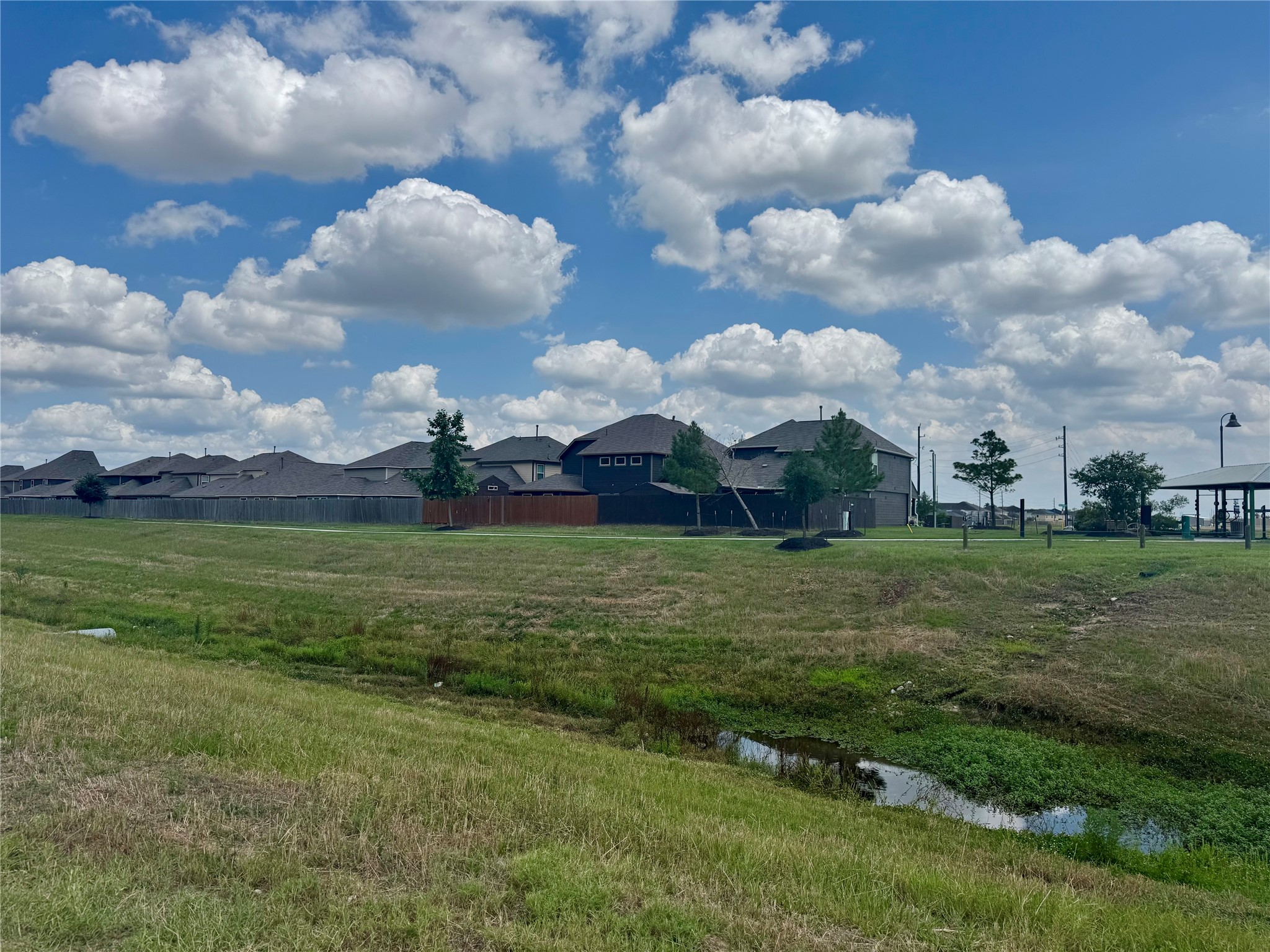 0 West Hardy Road Houston, TX 77073 - Photo 6 of 11 a view of a golf course with a lake
