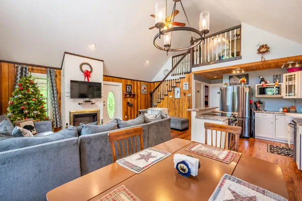 a living room with furniture fireplace and flat screen tv