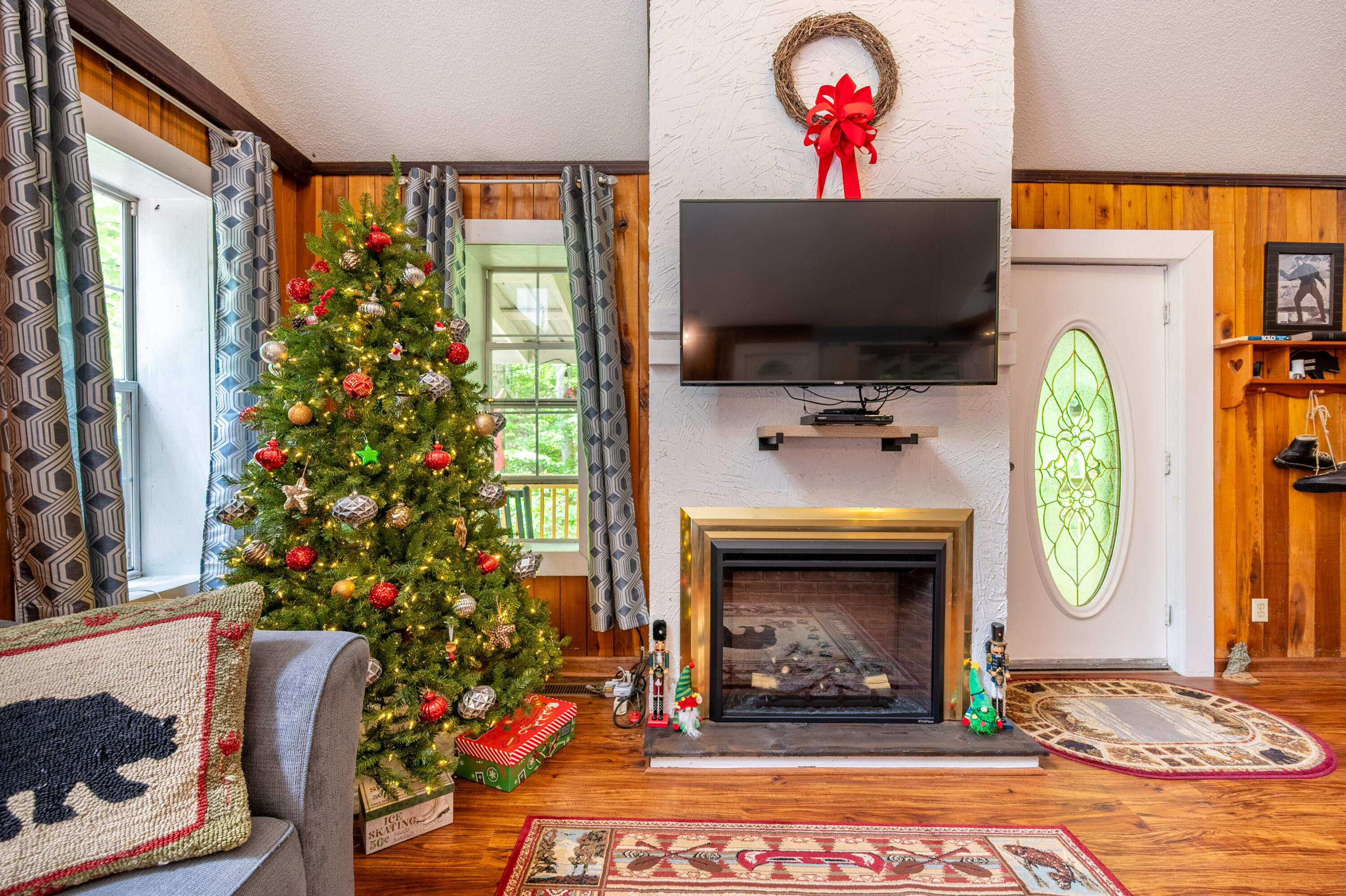 57 Buck Fever Lane Cana, VA 24317 - Photo 22 of 48 a living room with furniture a fireplace and a flat screen tv