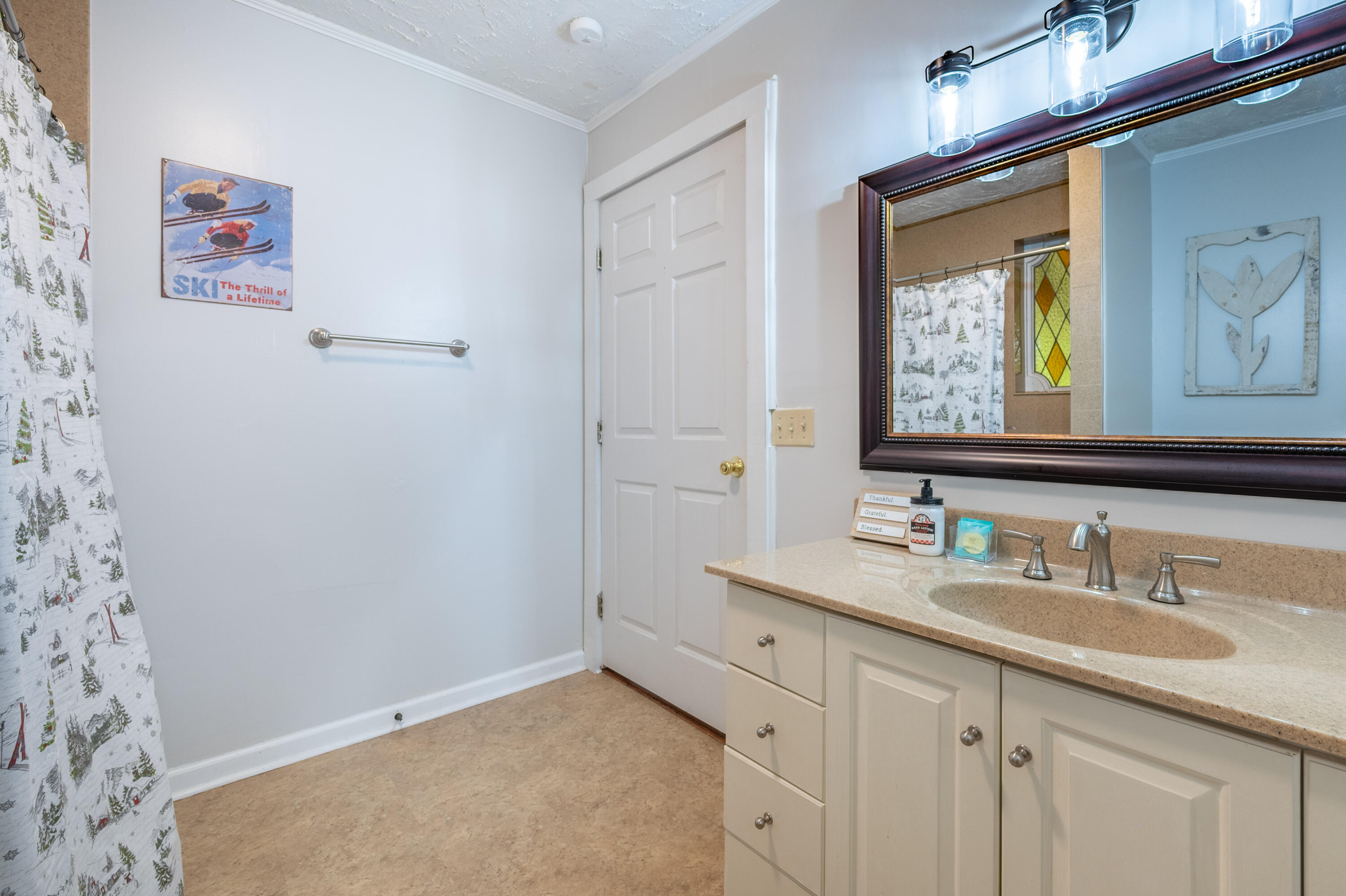 57 Buck Fever Lane Cana, VA 24317 - Photo 26 of 48 a bathroom with a granite countertop sink a mirror and a shower