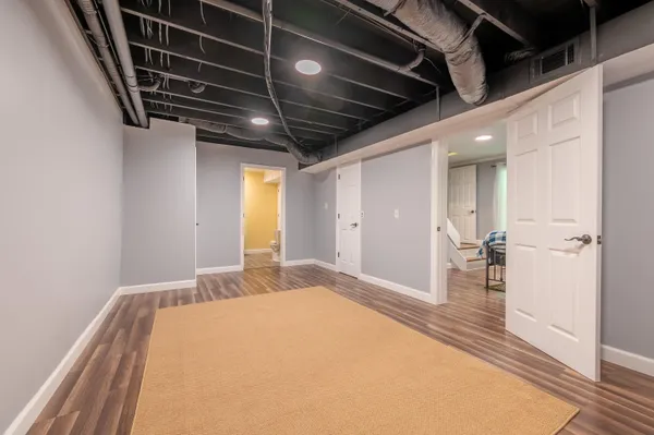 a bedroom with a bed and a view of walk in closet