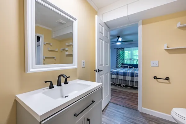 a bedroom with a large bed and a window