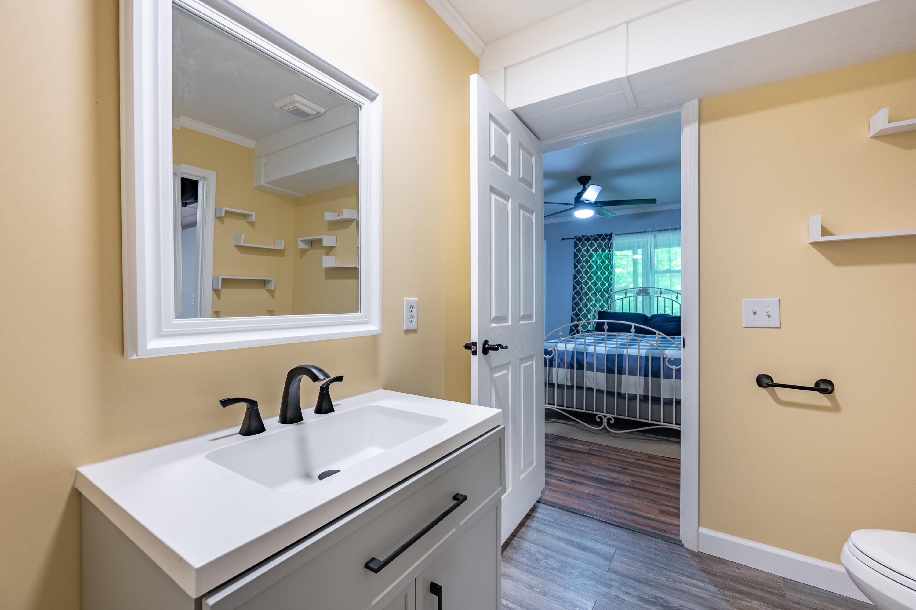 57 Buck Fever Lane Cana, VA 24317 - Photo 37 of 48 a bathroom with a sink and mirror