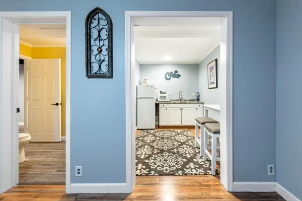 a kitchen with stainless steel appliances granite countertop a refrigerator and a stove top oven