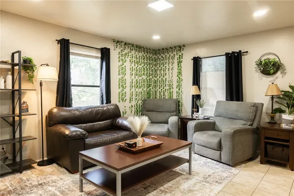 a living room with furniture and a window