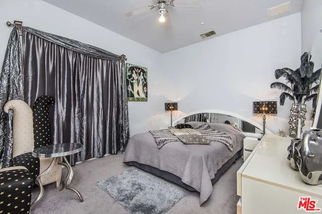 a bed room with a bed and a window