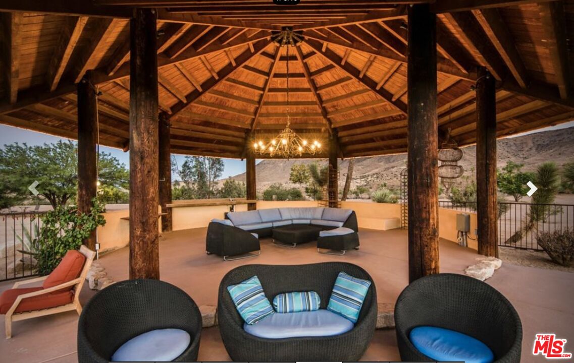 3569 Calmada Road Pioneertown, CA 92268 - Photo 17 of 18 a dining room with furniture and a large window