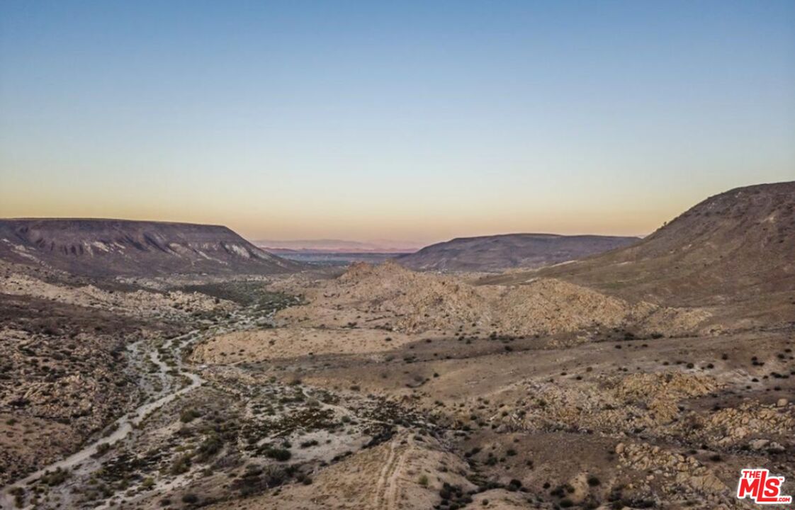 3569 Calmada Road Pioneertown, CA 92268 - Photo 18 of 18 a view of a house with a mountain