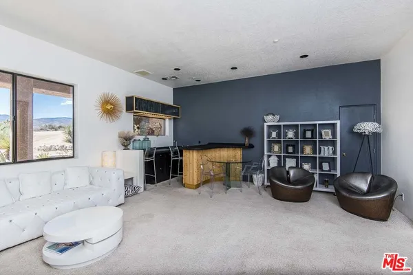 a living room with furniture and a couch