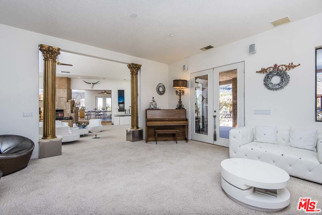 3569 Calmada Road Pioneertown, CA 92268 - Photo 10 of 18 a living room with furniture and a couch