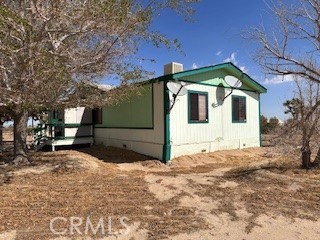 6450 Maricopa Road Phelan, CA 92371 - Photo 14 of 16 a front view of a house with a yard
