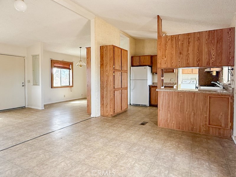6450 Maricopa Road Phelan, CA 92371 - Photo 5 of 16 a view of a kitchen with a sink