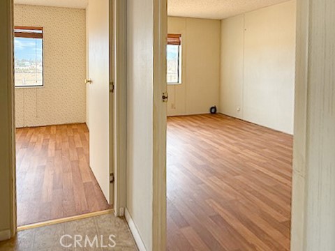 6450 Maricopa Road Phelan, CA 92371 - Photo 8 of 16 a view of a hallway with wooden floor and closet
