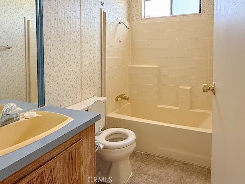 6450 Maricopa Road Phelan, CA 92371 - Photo 10 of 16 a bathroom with a sink a toilet and shower