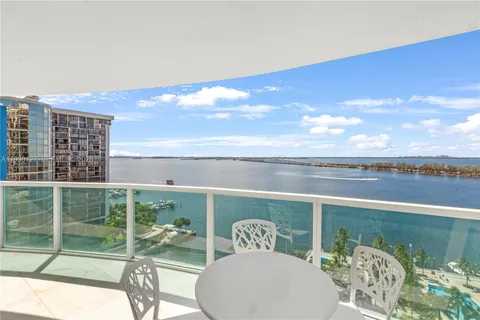 a view of a balcony with chair and table