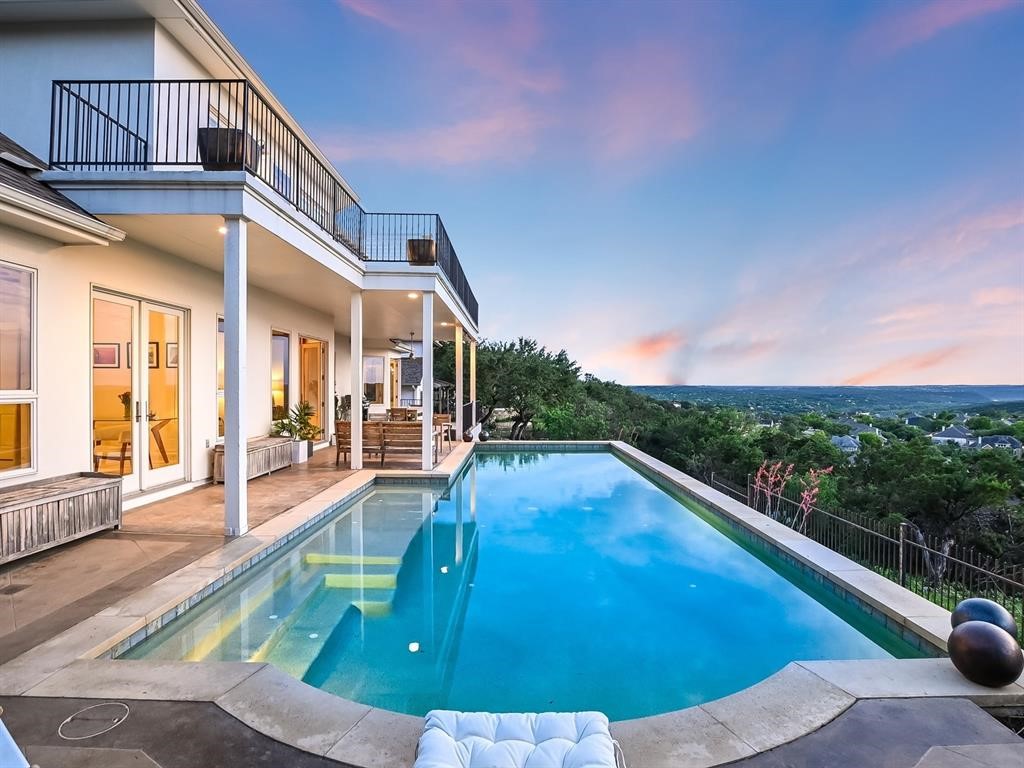 a view of swimming pool with lounge chair