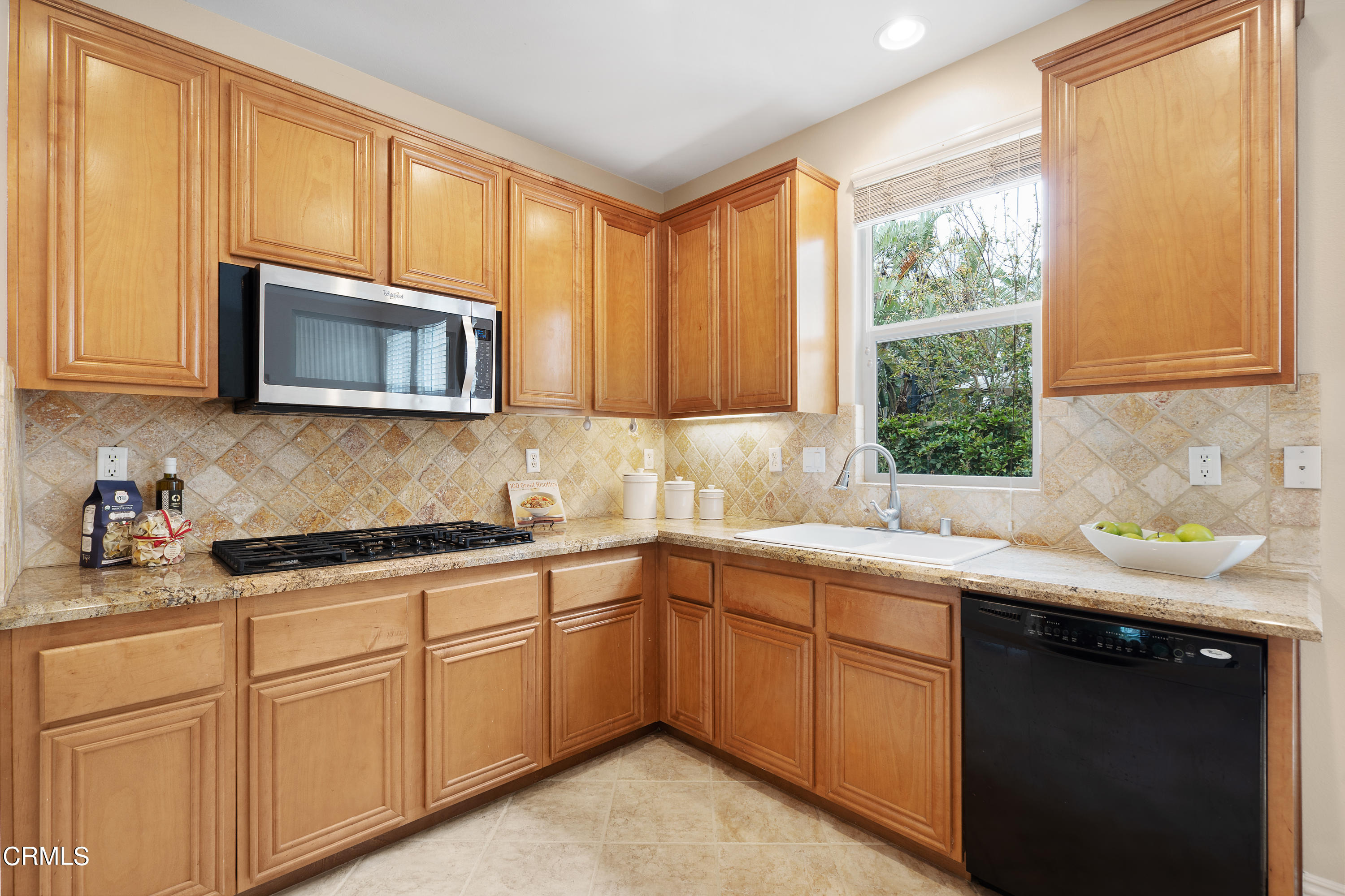 551 Spring Park Road Camarillo, CA 93012 - Photo 7 of 36 a kitchen with stainless steel appliances granite countertop white cabinets a sink and a microwave