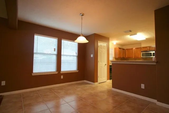 a view of a room with window furniture and floor to ceiling window