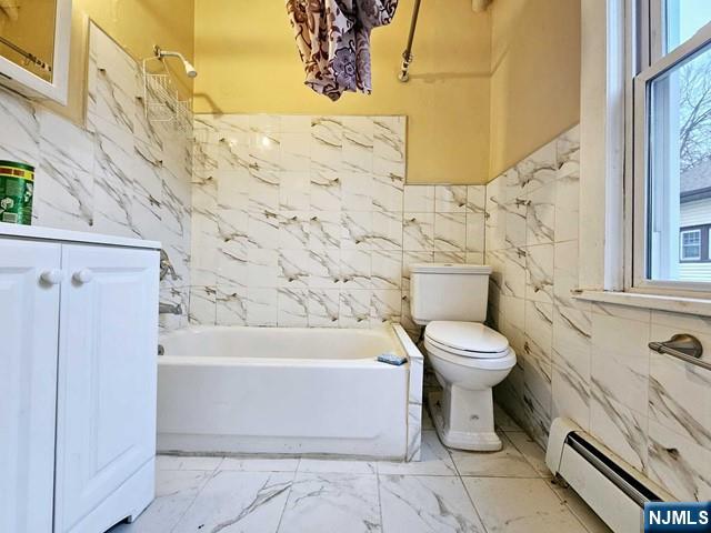 59 Robinson Street, Unit 1R Teaneck, NJ 07666 - Photo 6 of 6 a bathroom with a toilet and a shower