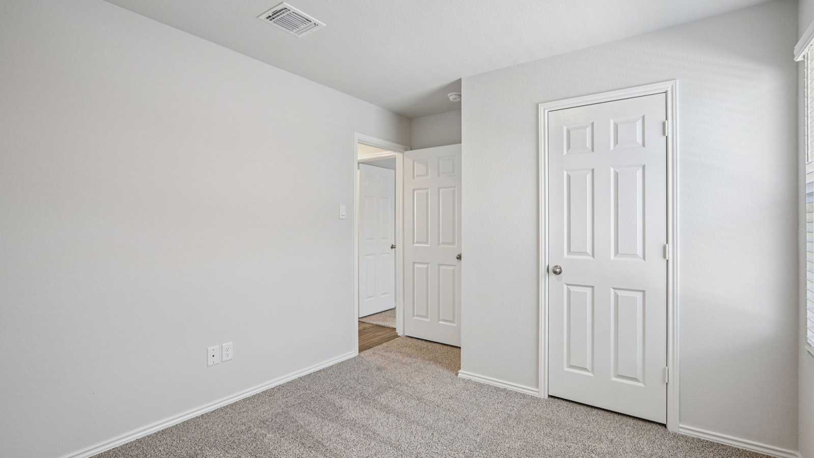 156 Wyatt Way Jarrell, TX 76537 - Photo 22 of 30 Room featuring light-colored walls, grey carpeting, and white trim