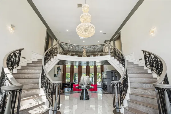 a view of entryway with a front door and wooden floor