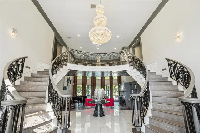 a view of entryway with a front door and wooden floor