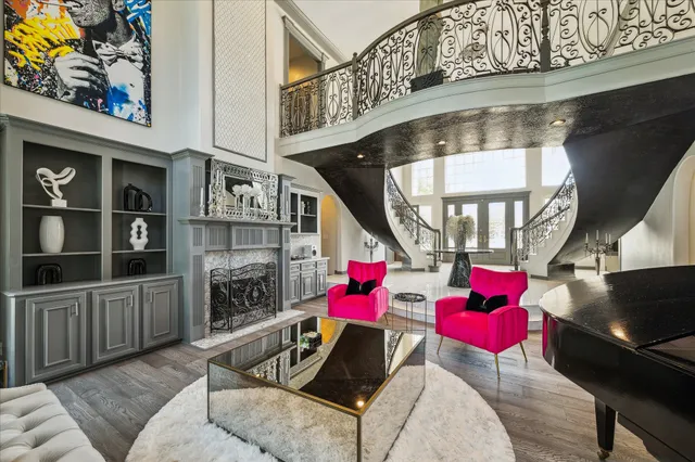 a living room with furniture a fireplace and a flat screen tv