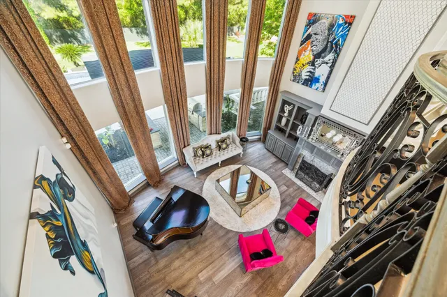 a living room with furniture and a floor to ceiling window