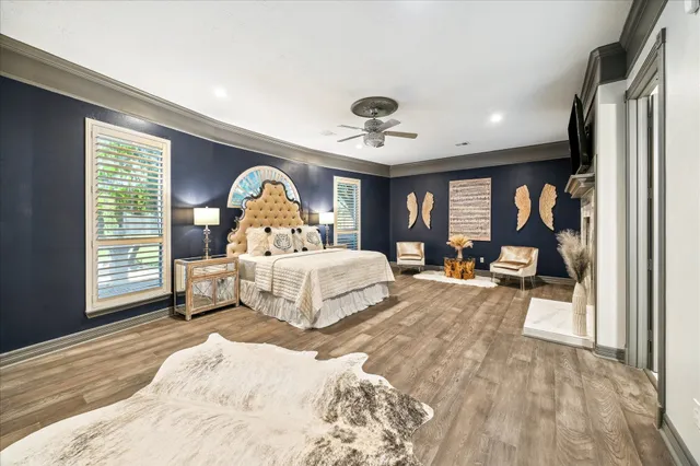 a white bath tub sitting in a room with a fireplace
