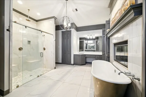 a bedroom with furniture and a large window