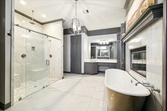 a bedroom with furniture and a large window