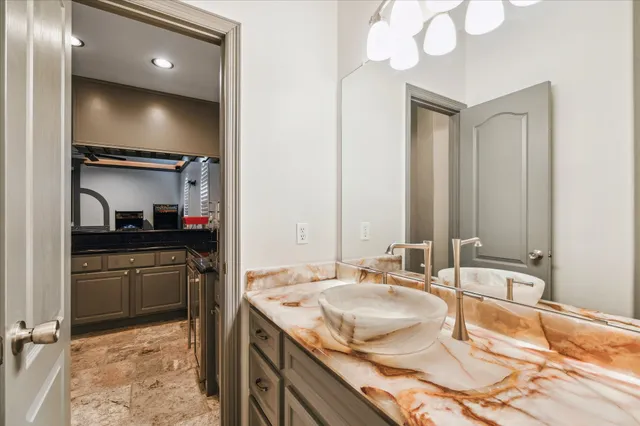 a bed room with a bed and a chandelier