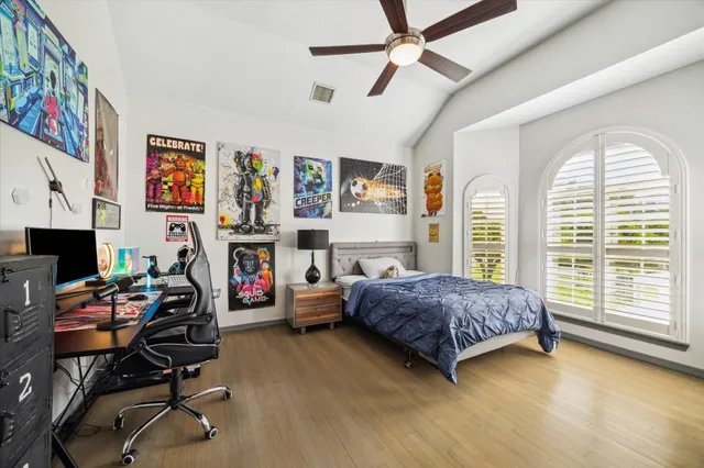 a bedroom with a bed and a walk in closet