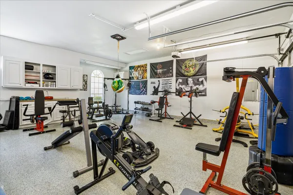 a view of a house with swimming pool and a yard