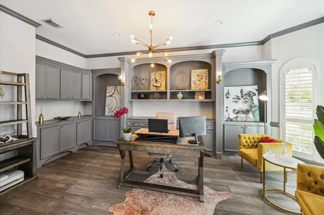 a living room with furniture a dining table wooden floor and a window