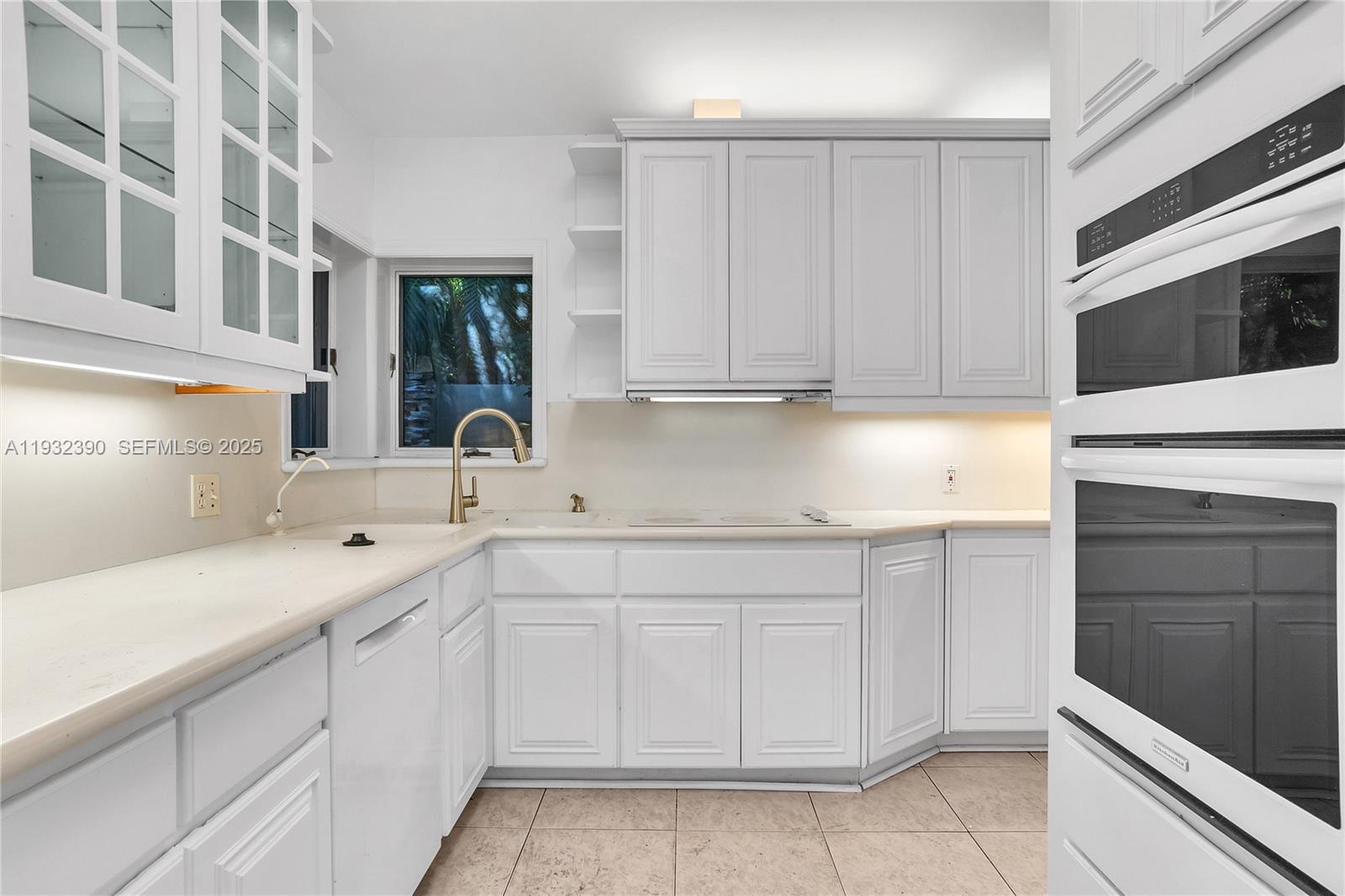 205 Northeast 16th Terrace Fort Lauderdale, FL 33301 - Photo 12 of 21 a kitchen with white cabinets and sink