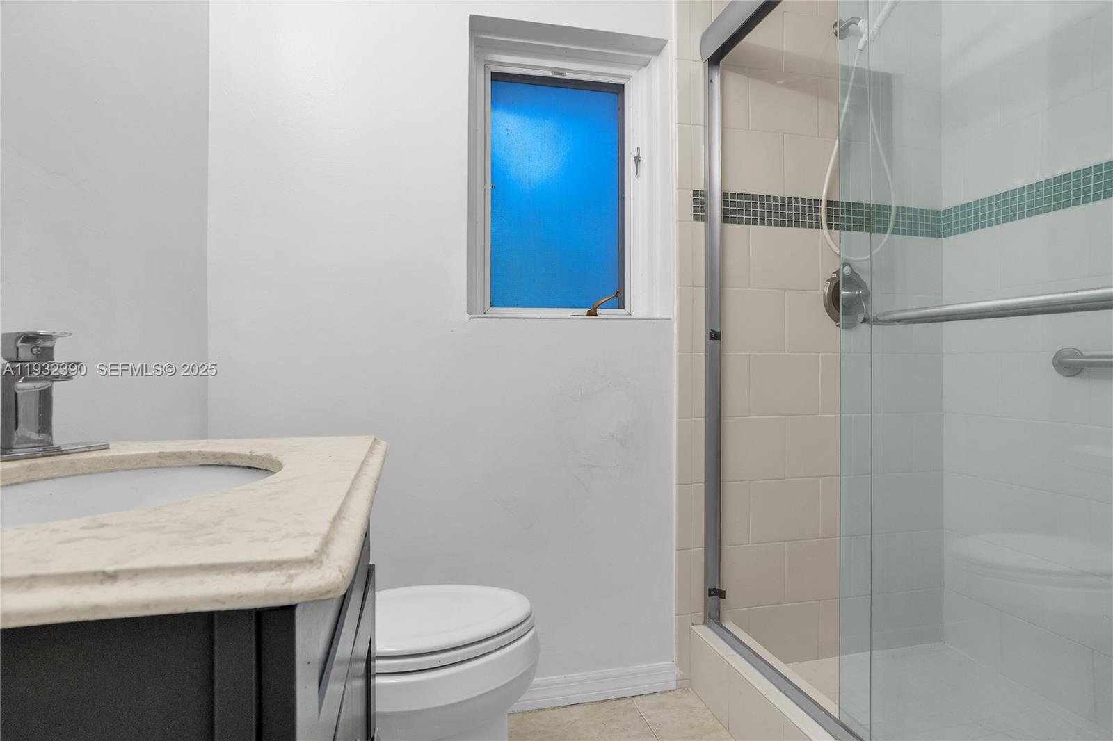 205 Northeast 16th Terrace Fort Lauderdale, FL 33301 - Photo 21 of 21 a bathroom with a granite countertop sink toilet and shower