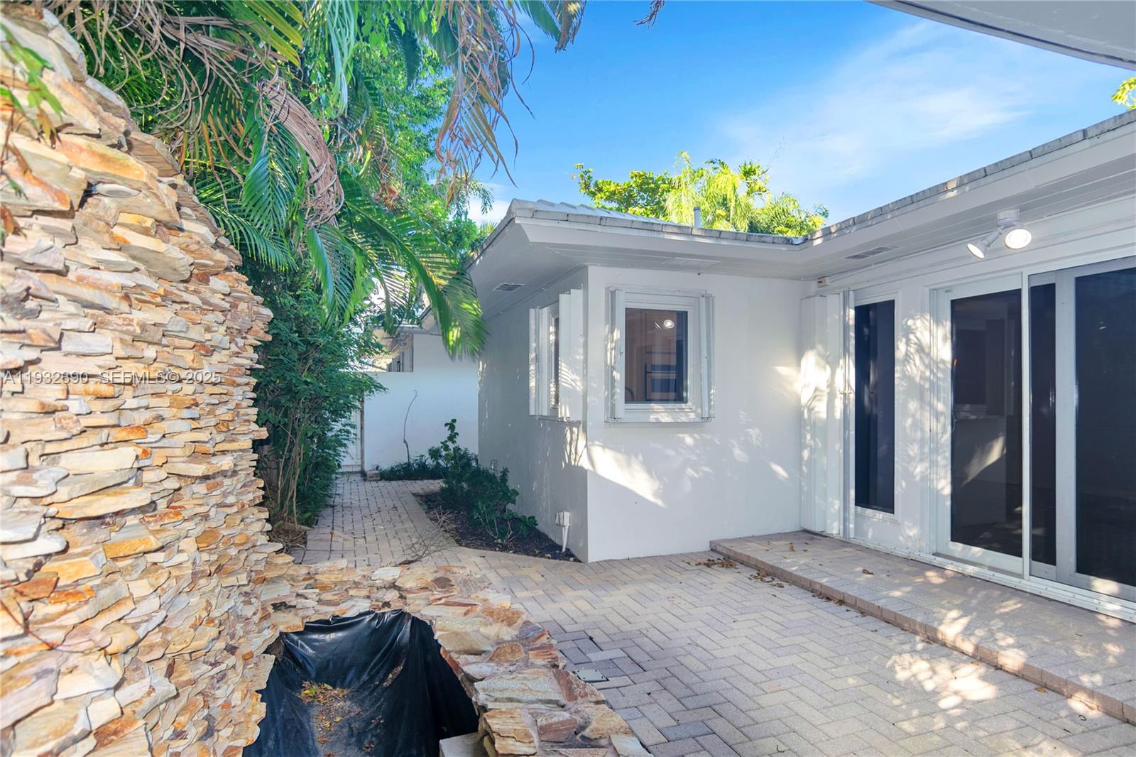 205 Northeast 16th Terrace Fort Lauderdale, FL 33301 - Photo 7 of 21 a front view of a house with a yard