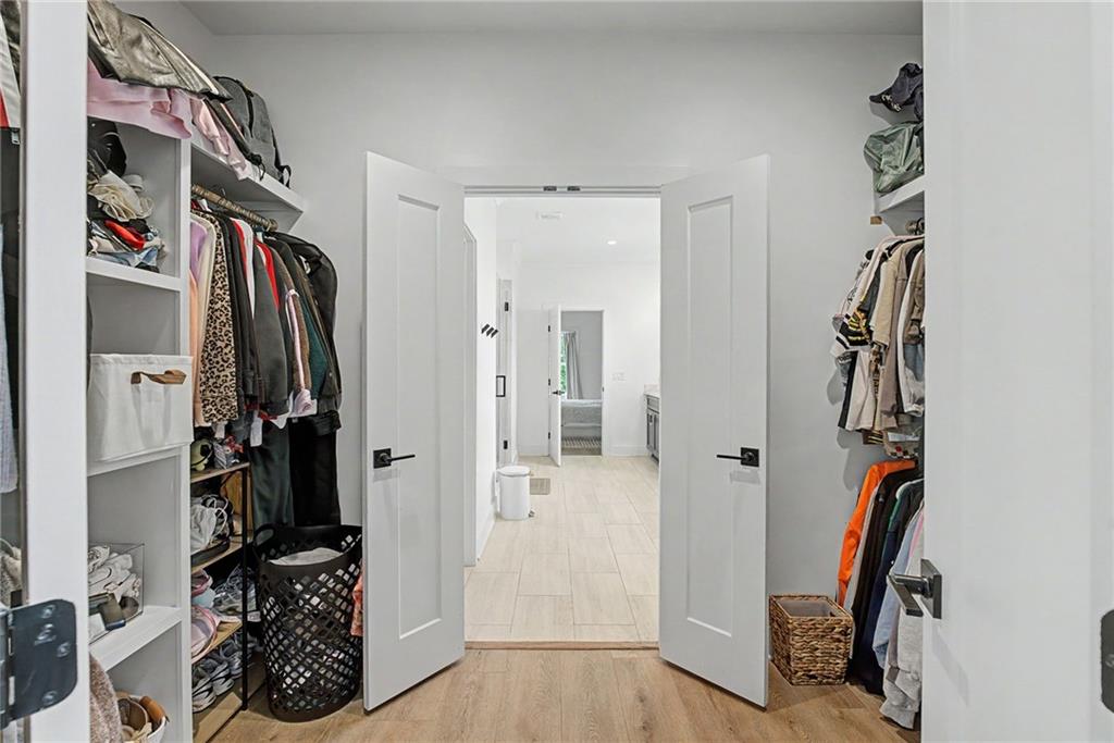 376 Hunnicut Road Southeast Mableton, GA 30126 - Photo 40 of 73 a view of walk in closet with clothes and shoes