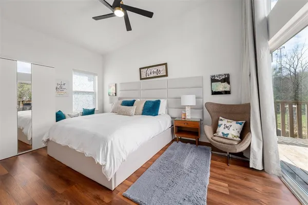 a bedroom with a bed and window