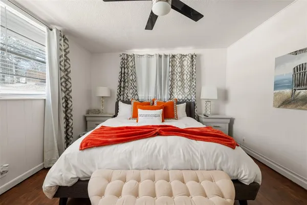 a bedroom with a bed and window