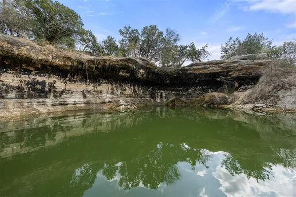 a view of a house with a yard covered in snow