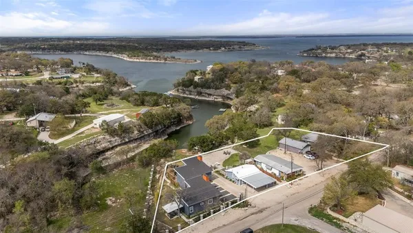 an aerial view of houses with yard