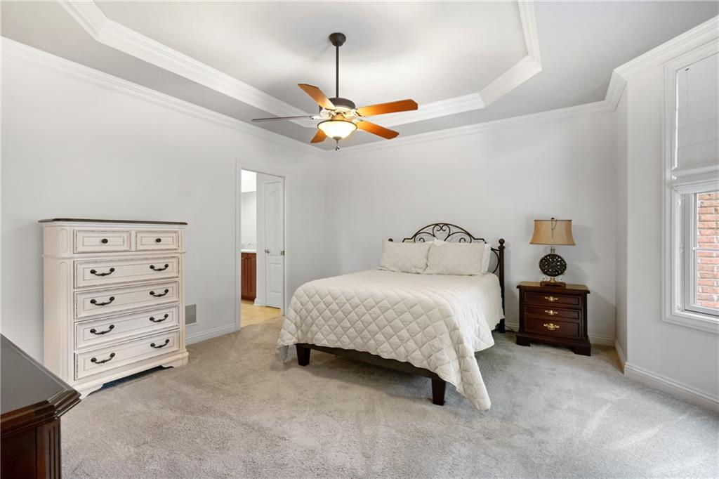 1737 Waterleaf Drive Sewickley, PA 15143 - Photo 13 of 34 a bedroom with a bed a dresser and a chandelier