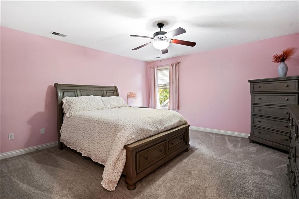 1737 Waterleaf Drive Sewickley, PA 15143 - Photo 19 of 34 a spacious bedroom with a bed and a chandelier
