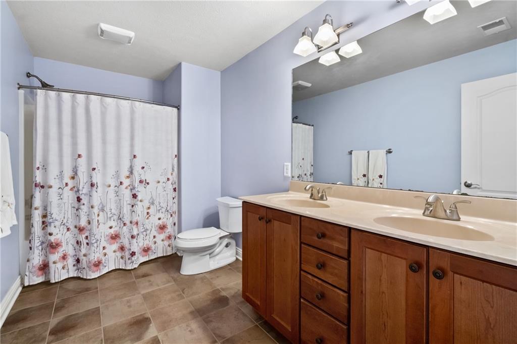 1737 Waterleaf Drive Sewickley, PA 15143 - Photo 20 of 34 a bathroom with a double vanity sink mirror and toilet