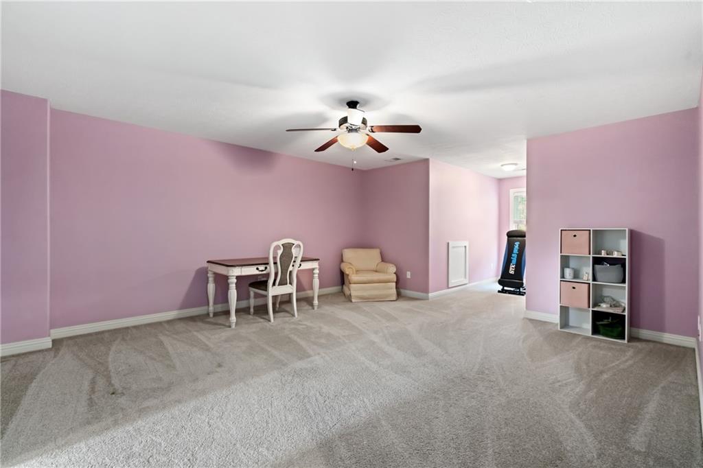 1737 Waterleaf Drive Sewickley, PA 15143 - Photo 21 of 34 a view of a livingroom with a chair and a chandelier fan