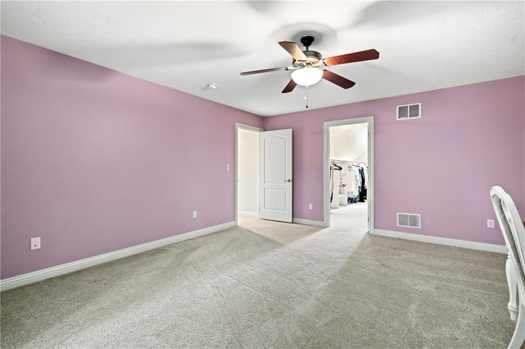 1737 Waterleaf Drive Sewickley, PA 15143 - Photo 22 of 34 a view of an empty room with a ceiling fan