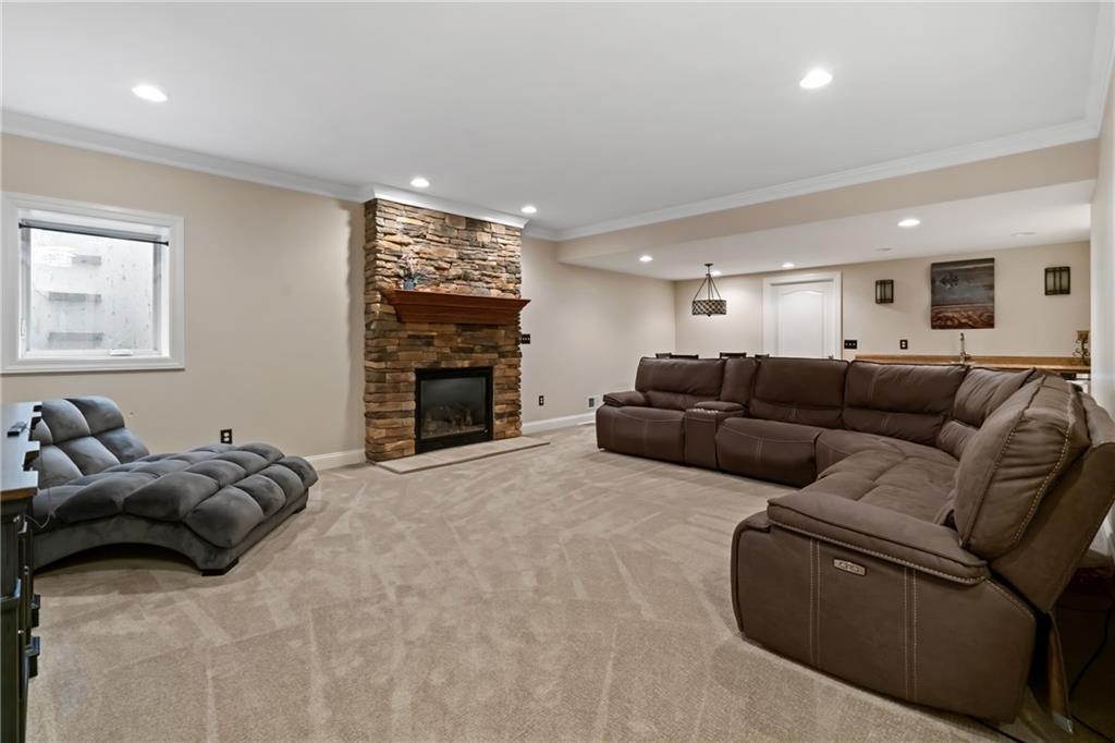 1737 Waterleaf Drive Sewickley, PA 15143 - Photo 24 of 34 a living room with furniture and a flat screen tv