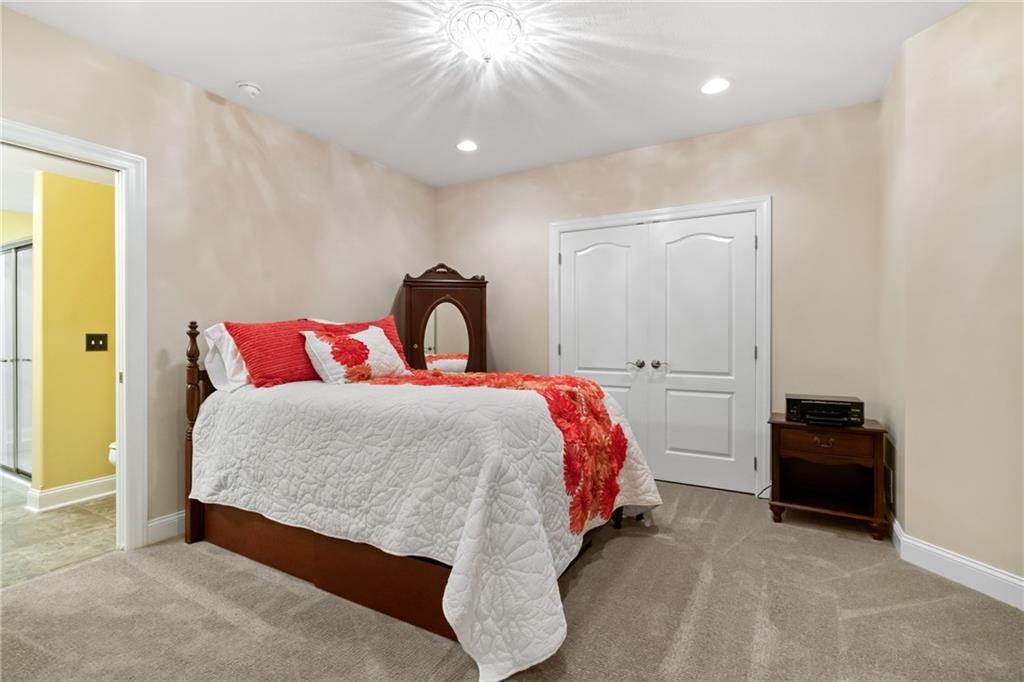 1737 Waterleaf Drive Sewickley, PA 15143 - Photo 26 of 34 a bedroom with a bed and a chandelier